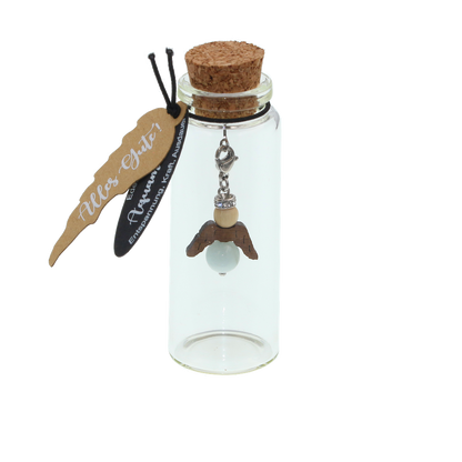 A guardian angel and companion made of walnut with sparkling crystal