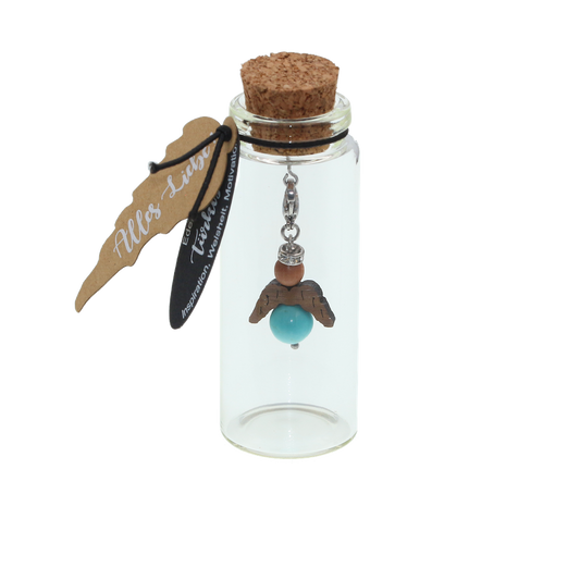 A guardian angel and companion made of walnut with sparkling crystal