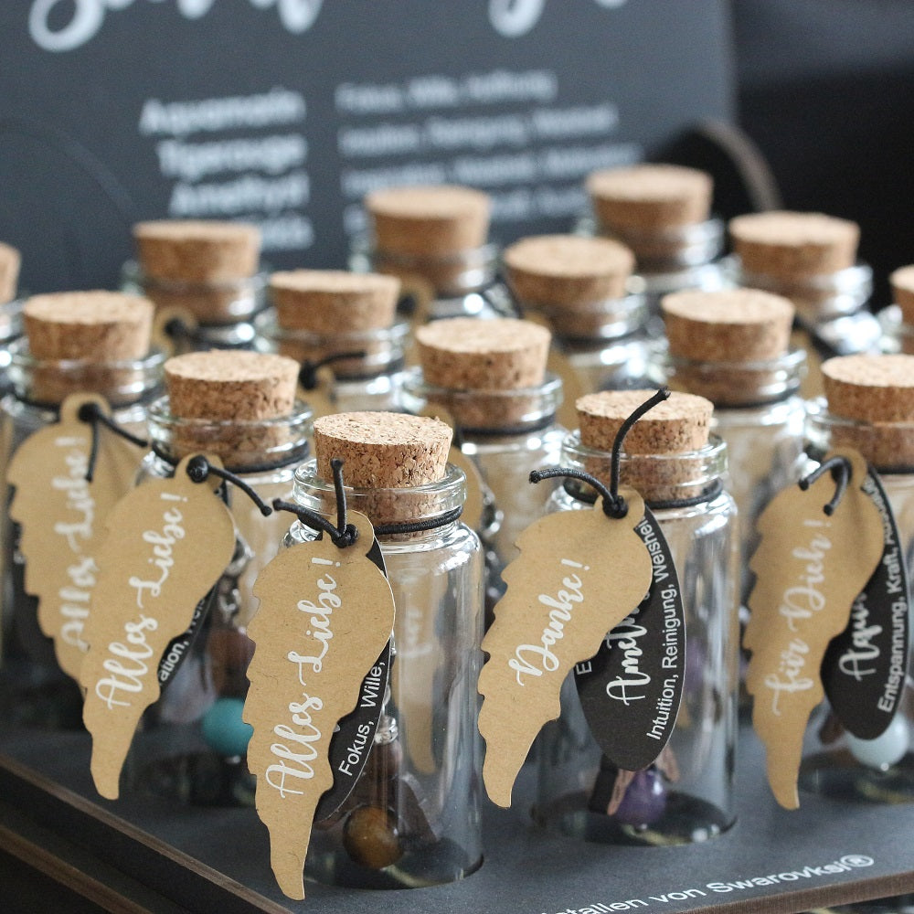 A guardian angel and companion made of walnut with sparkling crystal