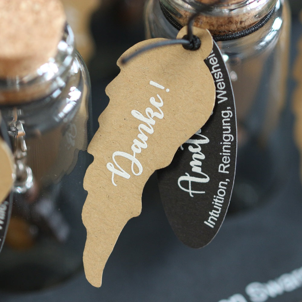 A guardian angel and companion made of walnut with sparkling crystal