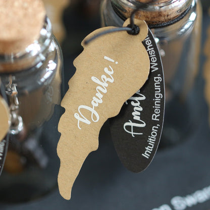 A guardian angel and companion made of walnut with sparkling crystal